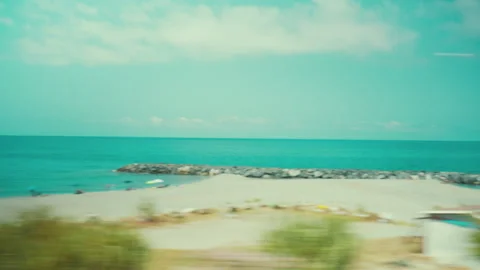 View from a train window: the beach at Paola, Calabria, in summer Stock Footage 340272151