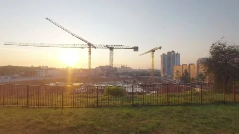 The view from the train window of the beautiful city with a construction site Stock Footage 158310020