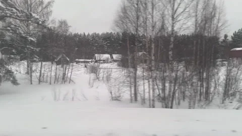 The view from a train window capturing a snowy area at north of Russia Stock Footage 314851207