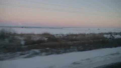 View from the train window on the evening winter landscape Stock Footage 180583942