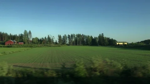 View from train window, Finland, green fields Stock Footage 91363597