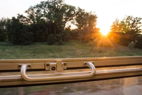 View from train window in high speed during sunset Stock Photos