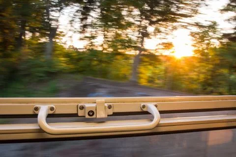 View from train window in high speed during sunset Фото