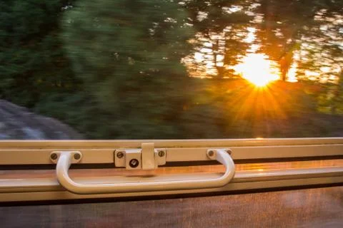 View from train window in high speed during sunset 写真素材