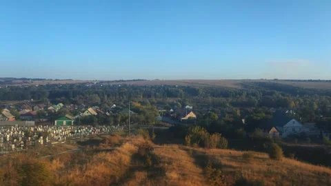 View from the train window of hills and ravines with residential buildings Stock Footage 297255692
