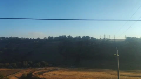 View from the train window of hills and ravines with residential buildings Stock Footage 300341091