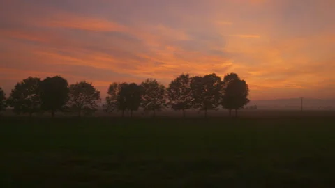 A view from the train window of an interesting landscape during sunset 스톡 동영상 253478910