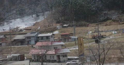 View from train window, Japan, urban landscape, mountains at backround. Beatiful Stock Footage 133064677