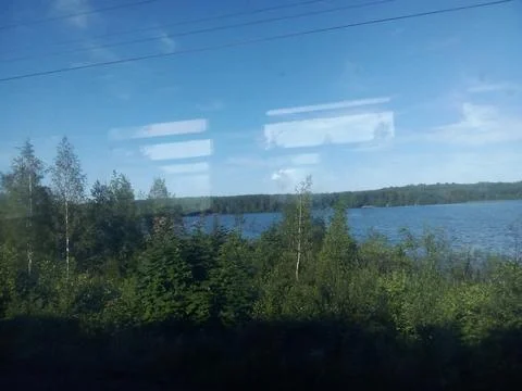 View from the train window to the lake Stock Photos