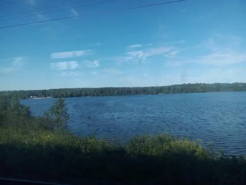 View from the train window to the lake Stock Photos
