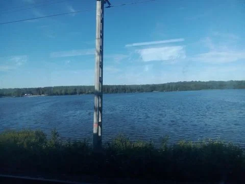 View from the train window to the lake Stock Photos
