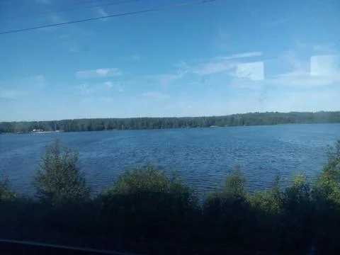 View from the train window to the lake Stock Photos