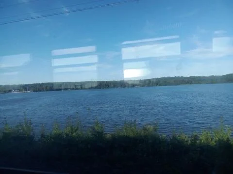 View from the train window to the lake Stock Photos