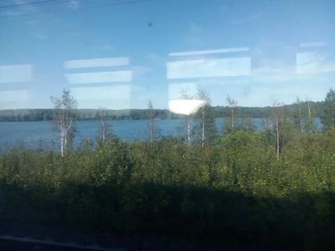 View from the train window to the lake Stock Photos
