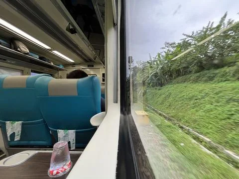 View from train window in motion of countryside and sky Stock Photos