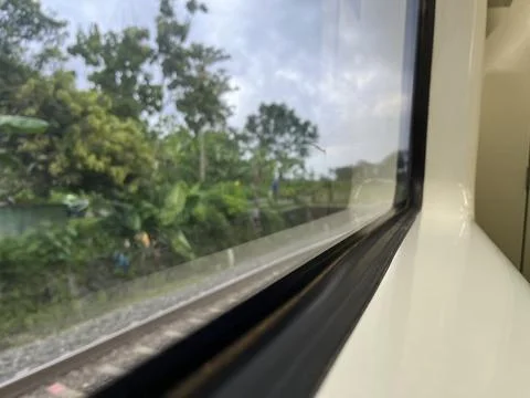 View from train window in motion of countryside Stock Photos