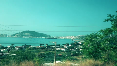 View from the train window at the mountain sea landscape Stock Footage 99777300