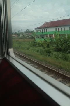 View from Train Window Overlooking Railway Tracks Stock Photos