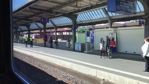 View from the train window on the passengers which stand on the  train piron. Stock Footage 74247468