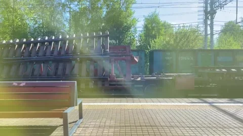 View from the train window on the passing landscape and the station and people 스톡 동영상 196010493
