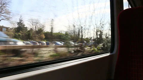 View from a train window passing parked cars Stock Footage 37221905