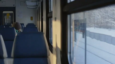 View from the train window passing by the village in winter Stock Footage 104700688