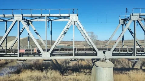 View from the train window. Railway bridge over the river. Stock Footage 246303766