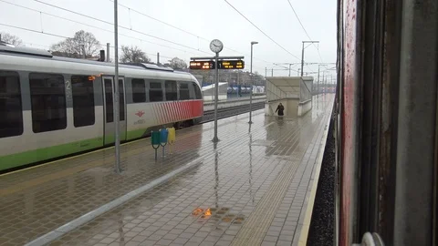 View from train window at railway station in rainy day Stock Footage 101173603