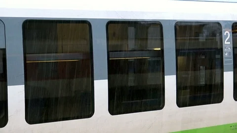 View from train window at railway station in rainy day Stock Footage 101174045