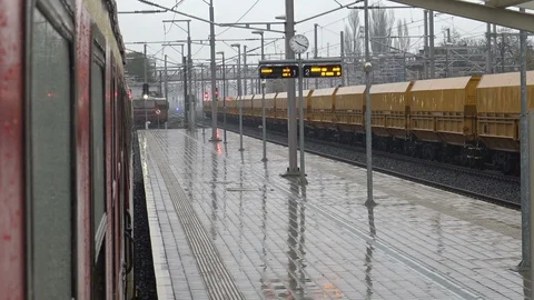 View from train window at railway station in rainy day Stock Footage 101174072