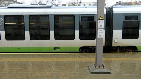 View from train window at railway station in rainy day Stock Footage 101174309