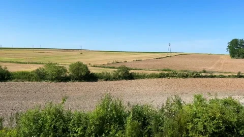 View from a train window of a rural landscape and fields in Poland. Video stock 318969842