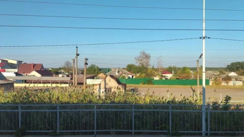 View from the train window stopping at the station with a view of the reeds and Stock-Footage 295603031