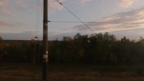 View from the train window at sunset time in autumn Stock Footage 202162776