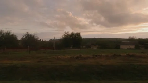 View from the train window at sunset time in autumn Stock Footage 202577918