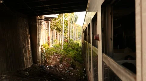 View from train window in Yangon of Myanmar - train stops Stock Footage 61449537