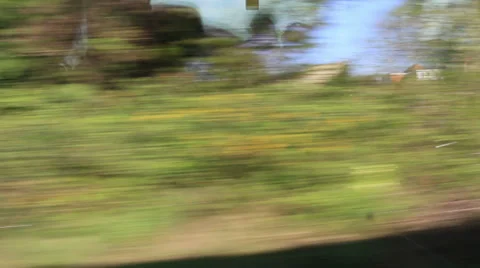 View from a train windowtrees and urban houses Stock Footage 37223879