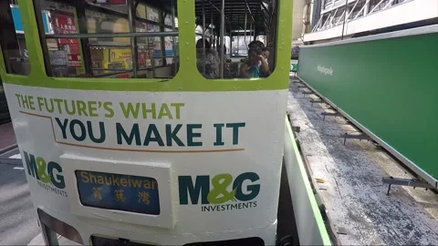 View from tram at MTR stop, back view vehicle shot, Hong Kong downtown street Stock Footage 170771863