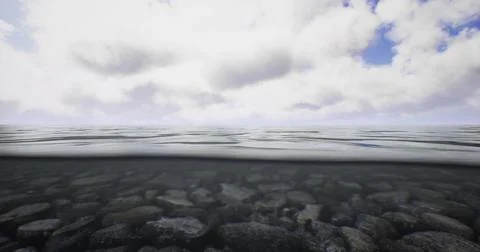 View of tranquil water surface with clouds reflecting above and stones below 스톡 일러스트