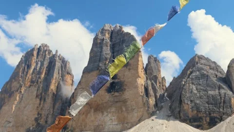 View of Tre Cime di Lavaredo mountain with prayer flags Stock Footage 257814189