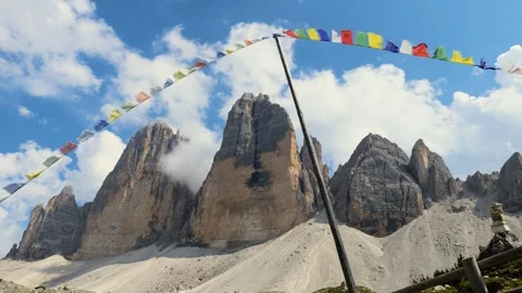View of Tre Cime di Lavaredo mountain with prayer flags Stock Footage 259195460