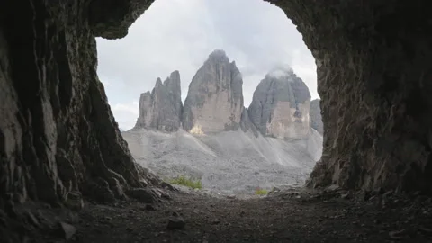 View of Tre Cime di Laveredo/ Drei Zinnen/ Three peaks from a cave Stock Footage 150370632