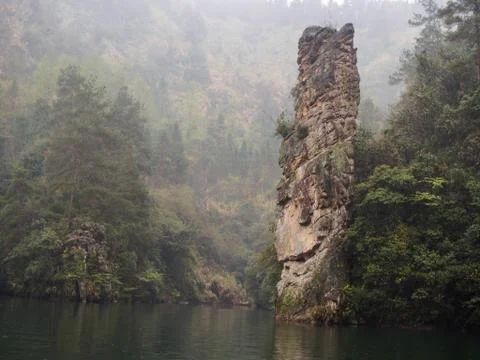 View of trees and mountains in the thick fog and low light , Zhangjiajie Chin Stock Photos