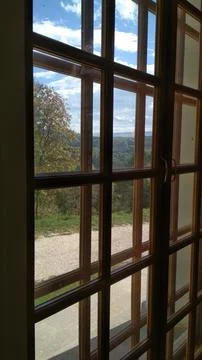 View of the trees and mountains from the window Stock Photos