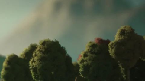 View of trees with backdrop of mountains and sky during daylight Stock Footage 340029349
