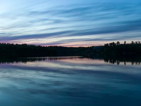 View of trees at lakeside during sunset, Lake of The Woods, Ontario, Canada 스톡 사진