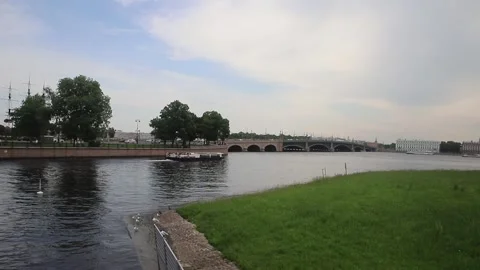 View of The Trinity Bridge and a passing touristic boat, from The Hare Islan Stock Footage 312341695