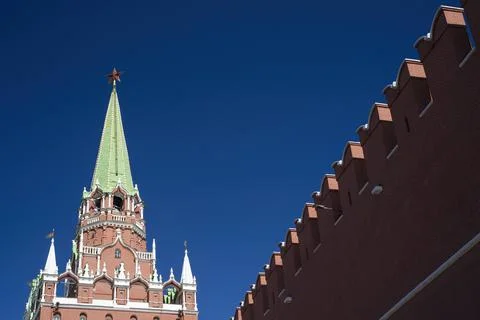 View of the Trinity tower of the Moscow Kremlin with a fortress wall on a Sunny Stock Photos