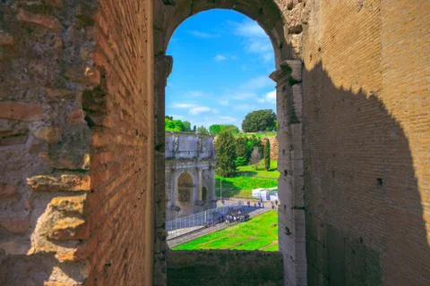 View of the Triumphal Arch of Constantine through the arch of the Colosseum Stock Photos