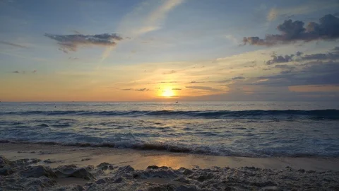 View from tropical beach of sunset in ocean with blue water Stock Footage 115037774